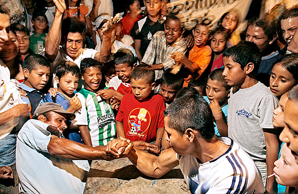 photograph of arm wrestling competition