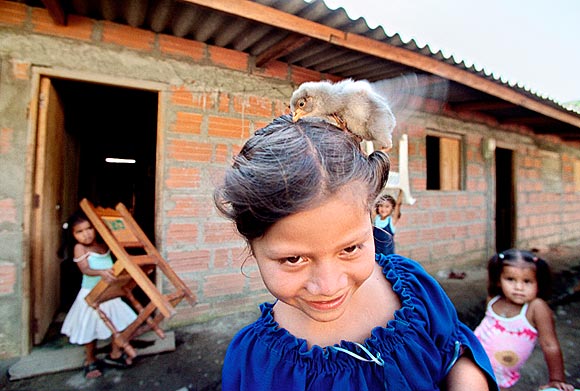 photograph of children gathering outside the new homes